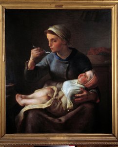 Mujer alimentando a su hijo